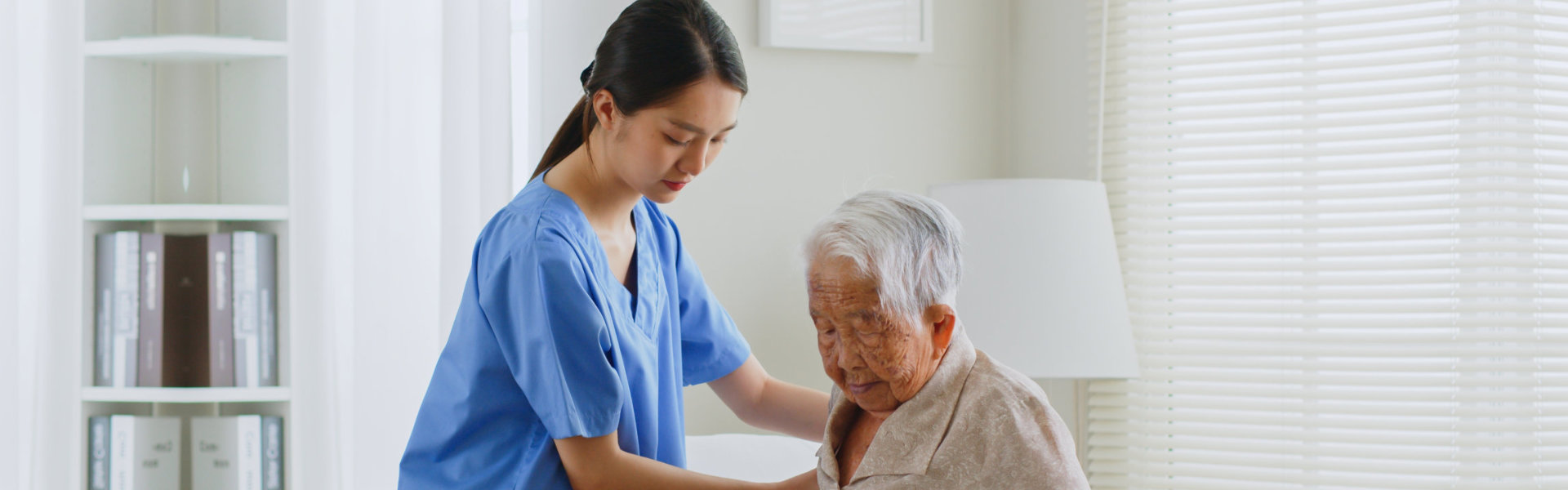 nurse assisting senior patient